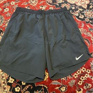 Nike Stride Shorts - size L - black - with built in compression shorts.